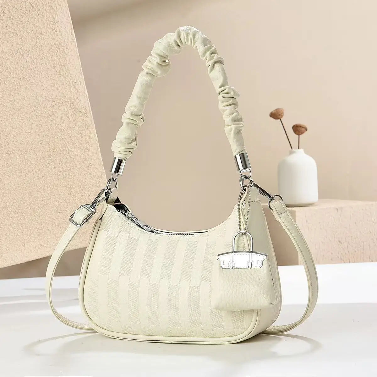 EtherealBe light luxury niche shoulder bag in cream with ruched handle detachable strap and textured stripe pattern