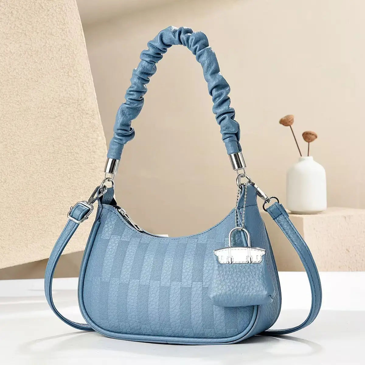 Blue ruched handle light luxury niche shoulder bag with checker texture detachable strap and mini pouch charm