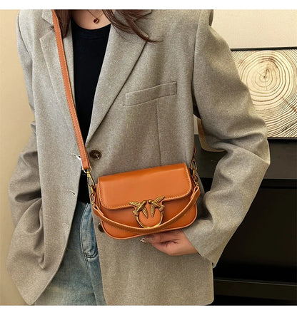 EtherealBe versatile small square tote bag style cognac leather crossbody with decorative bird ring clasp and adjustable strap