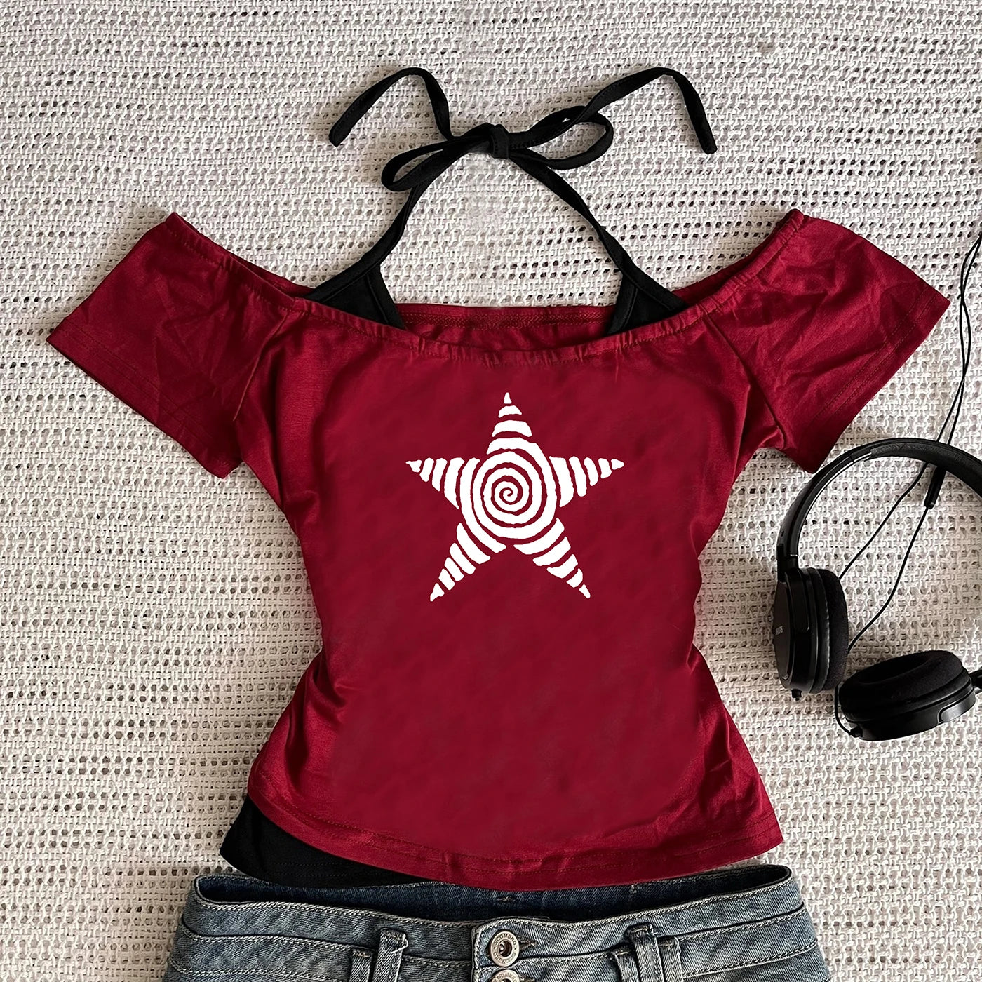 Red off-the-shoulder top featuring a black and white star print top design, perfect for casual wear