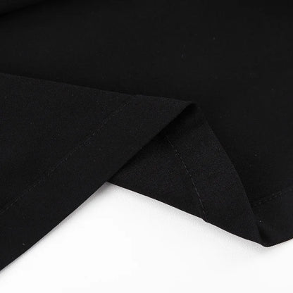 Close-up of the smooth fabric of a black high waist maxi skirt by EtherealBe