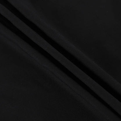 Close-up view of black high waist maxi skirt fabric with smooth texture and elegant drape
