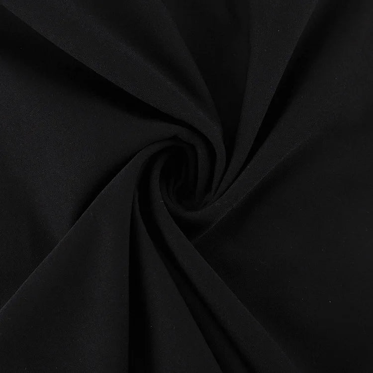 Soft fabric swirl of black high waist maxi skirt showcasing elegant drape and texture