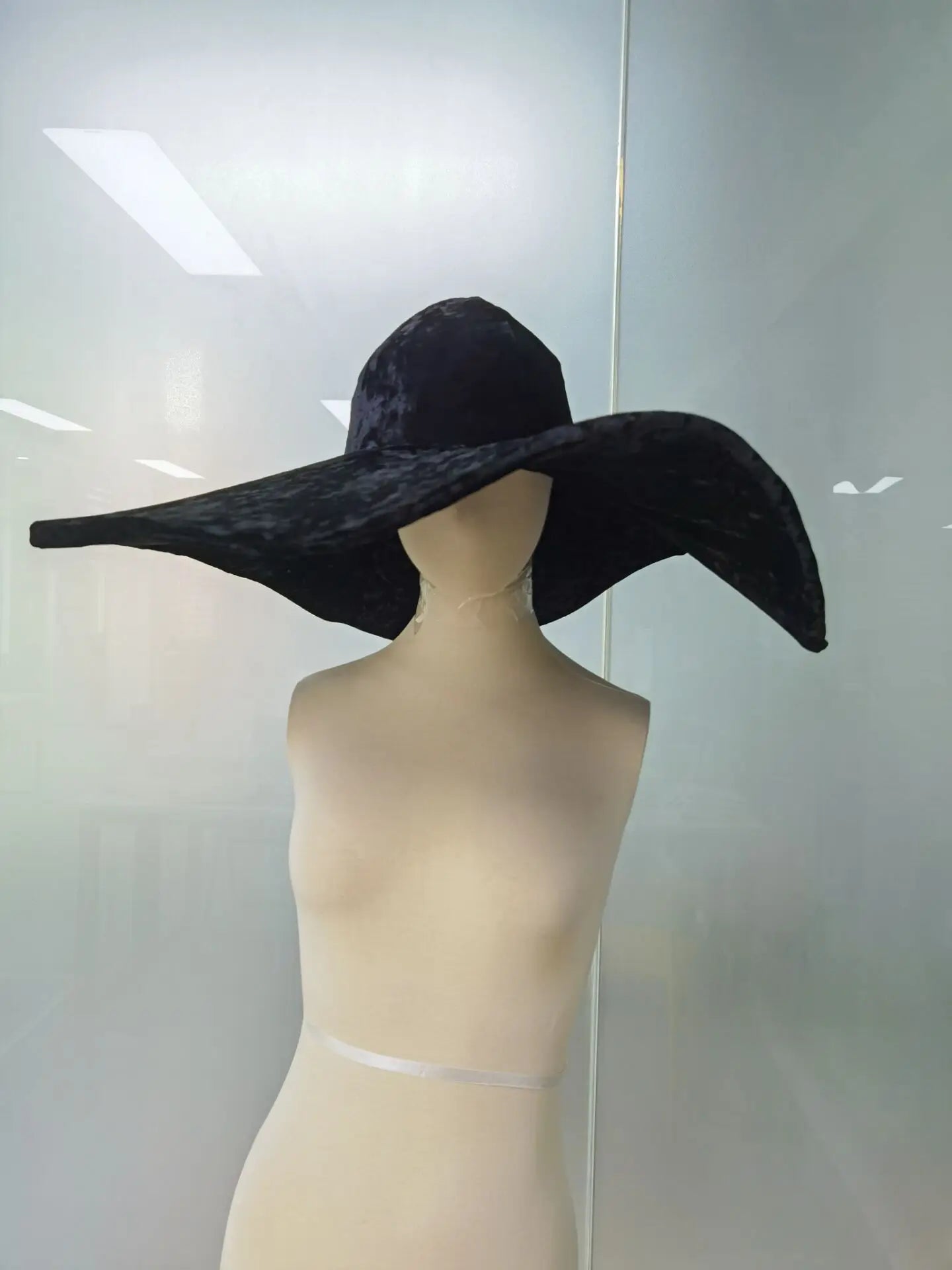 Stylish black velvet large brim hat with an elegant wide brim for fashionable women