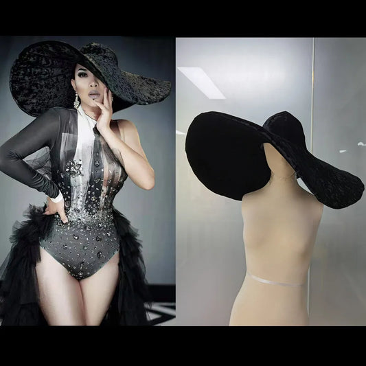 Elegant model showcasing a black velvet large brim hat paired with a stylish outfit