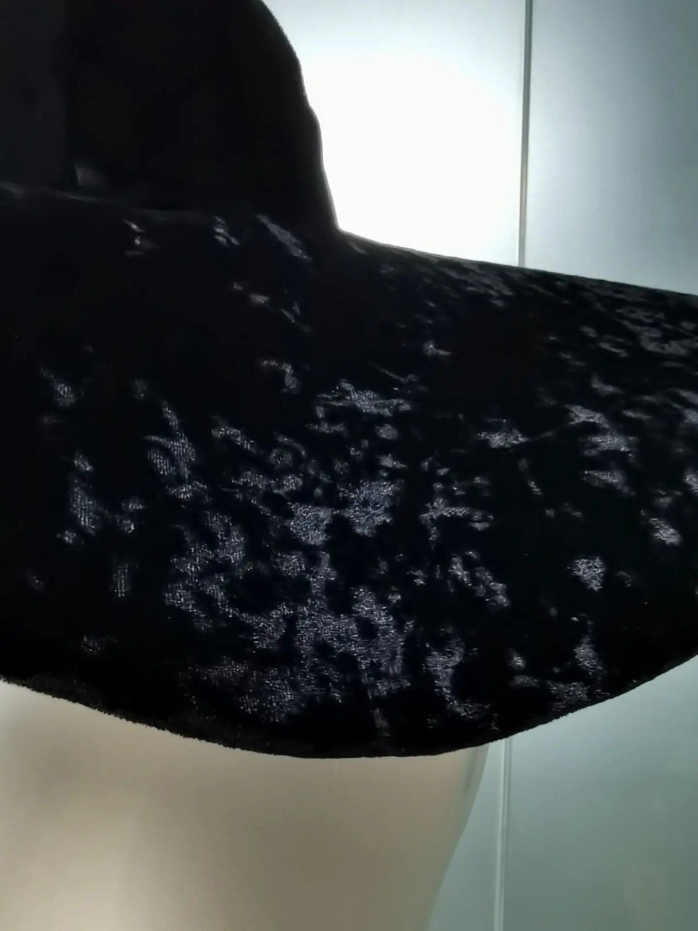 Black velvet large brim hat featuring luxurious texture and stylish design for any occasion