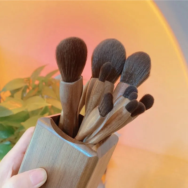 EtherealBe black walnut makeup brush set displayed in a wooden holder for flawless makeup application