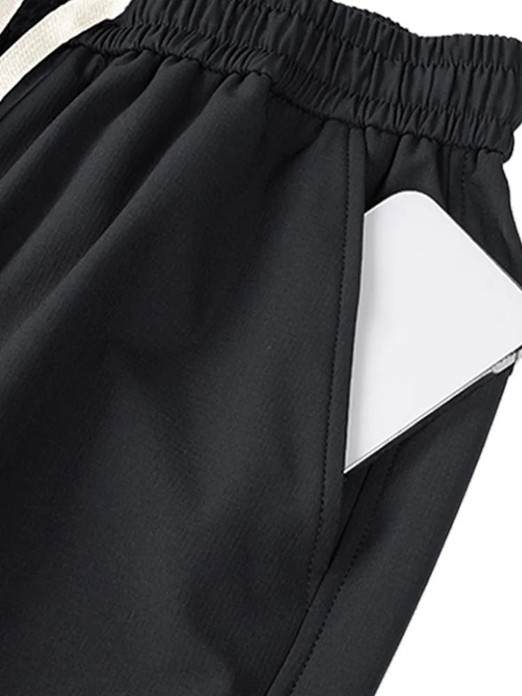 Close-up of black wide leg cargo pants women featuring side pockets for stylish comfort