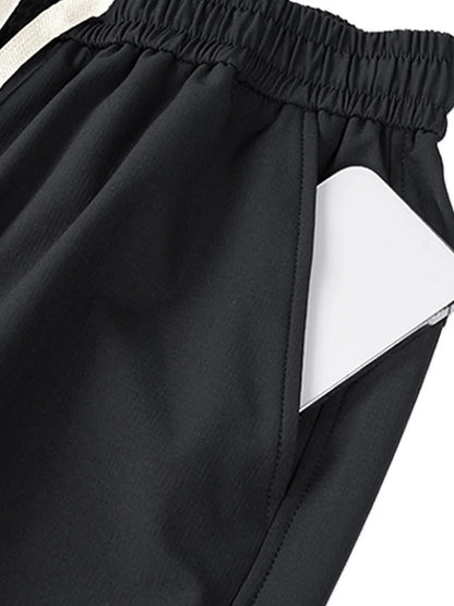 Close-up of black wide leg cargo pants women featuring side pockets for stylish comfort