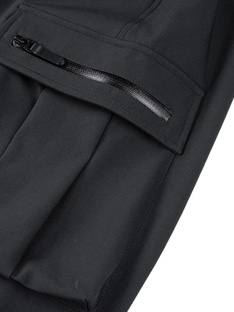 Close-up of black wide leg cargo pants women featuring stylish pockets and modern design