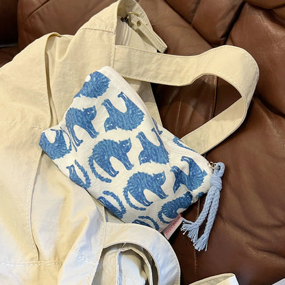 EtherealBe blue cat makeup bag with a playful cat pattern on a stylish cosmetic pouch