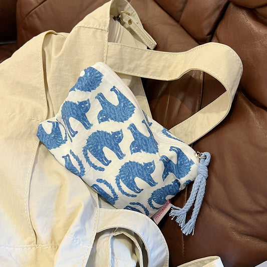 EtherealBe blue cat makeup bag with a playful cat pattern on a stylish cosmetic pouch