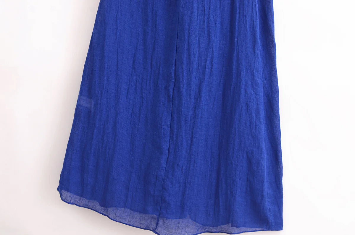 EtherealBe blue halter backless summer dress with a flowy design perfect for warm weather