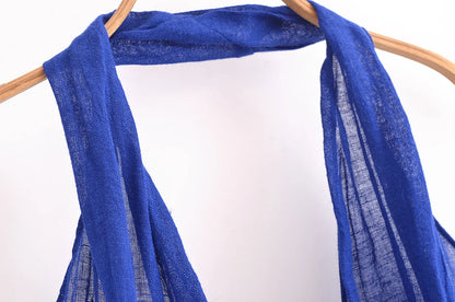 Close-up of a blue halter backless summer dress showcasing the fabric and draping details