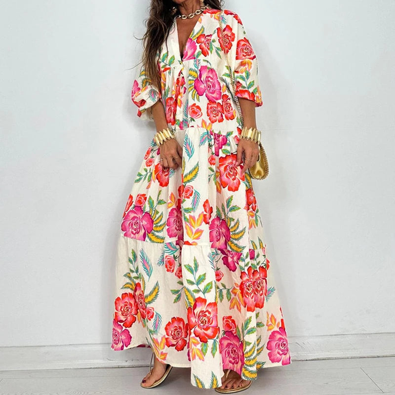 EtherealBe elegant printed v-neck maxi dress with bold pink and red floral print and puff sleeves and tiered skirt