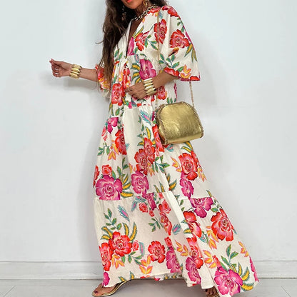 EtherealBe elegant printed v-neck maxi dress white with bold pink and orange floral print tiered skirt and gold chain bag