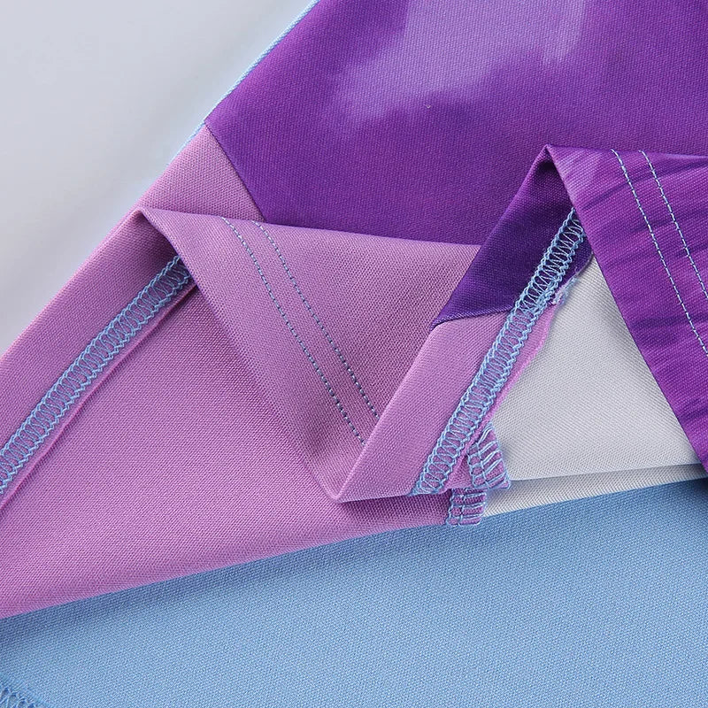 Close up of purple and pink fabric seams and hem details on a fitted strap party dress for women showing stitching
