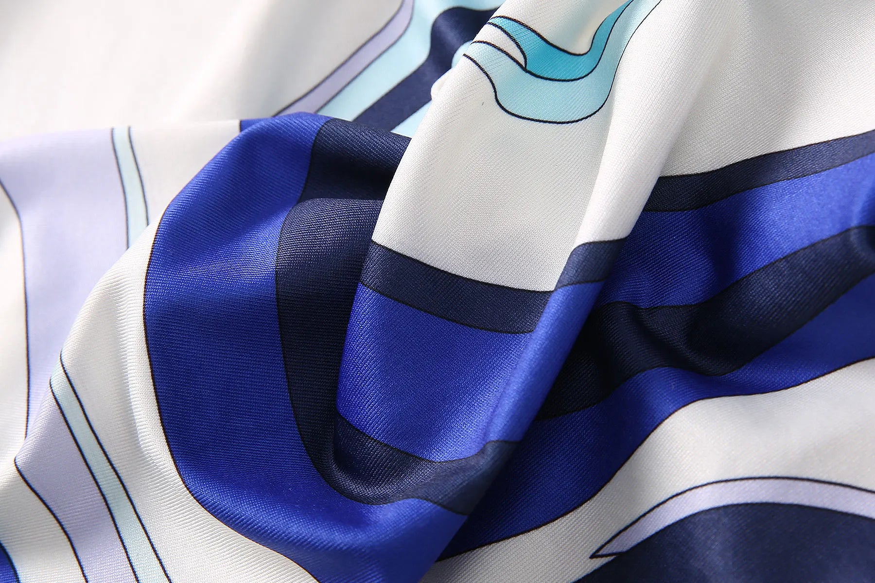 Close-up of luxurious fabric showcasing a breathable round neck fashion vestido with vibrant patterns