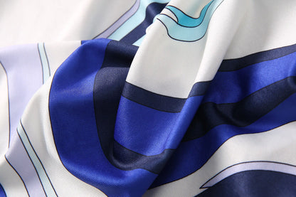 Close-up of luxurious fabric showcasing a breathable round neck fashion vestido with vibrant patterns