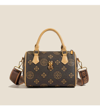 Designer leather tote bag with brown pattern and detachable shoulder strap for stylish organization