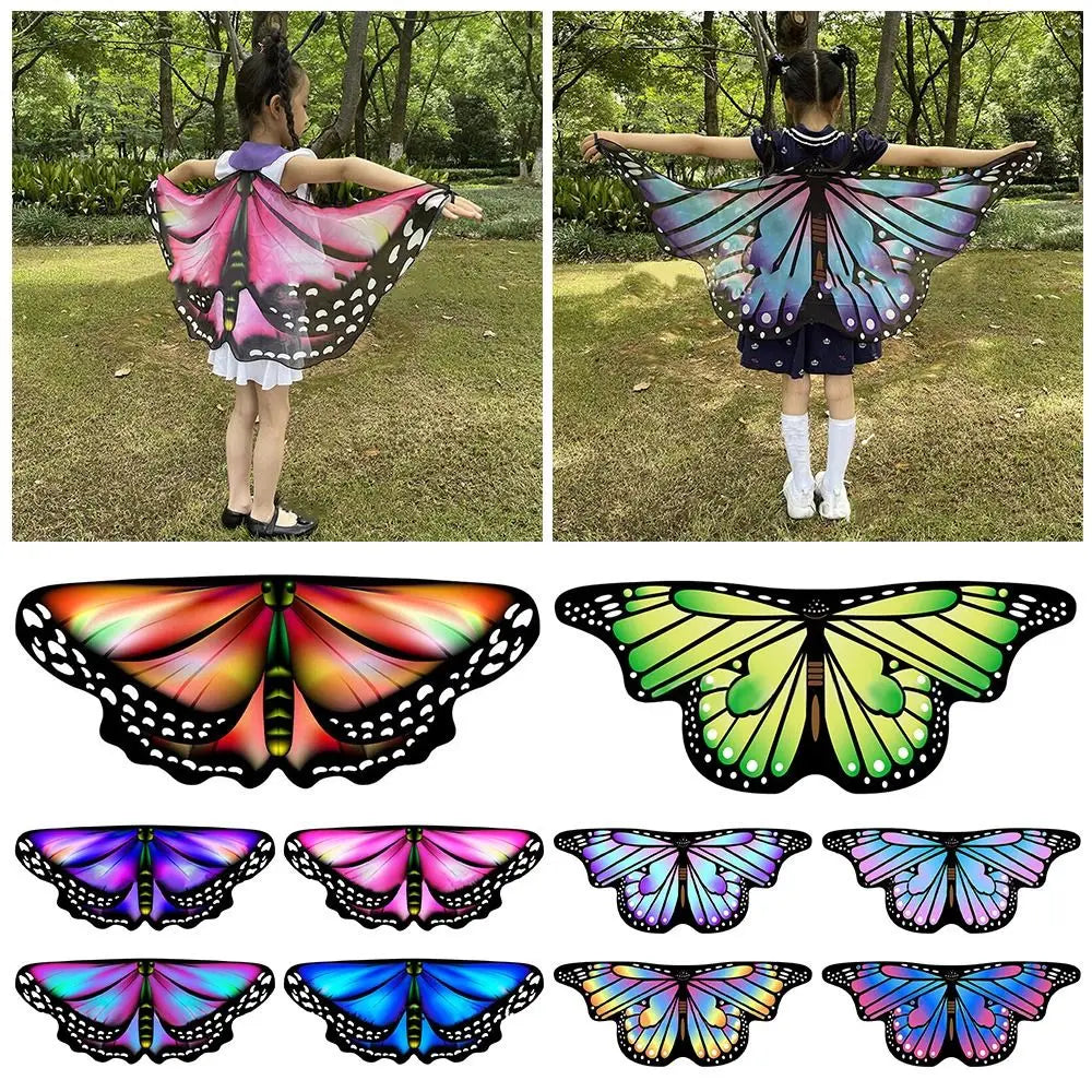 Kids wearing butterfly elf stage costume for kids with colorful wings in a natural outdoor setting