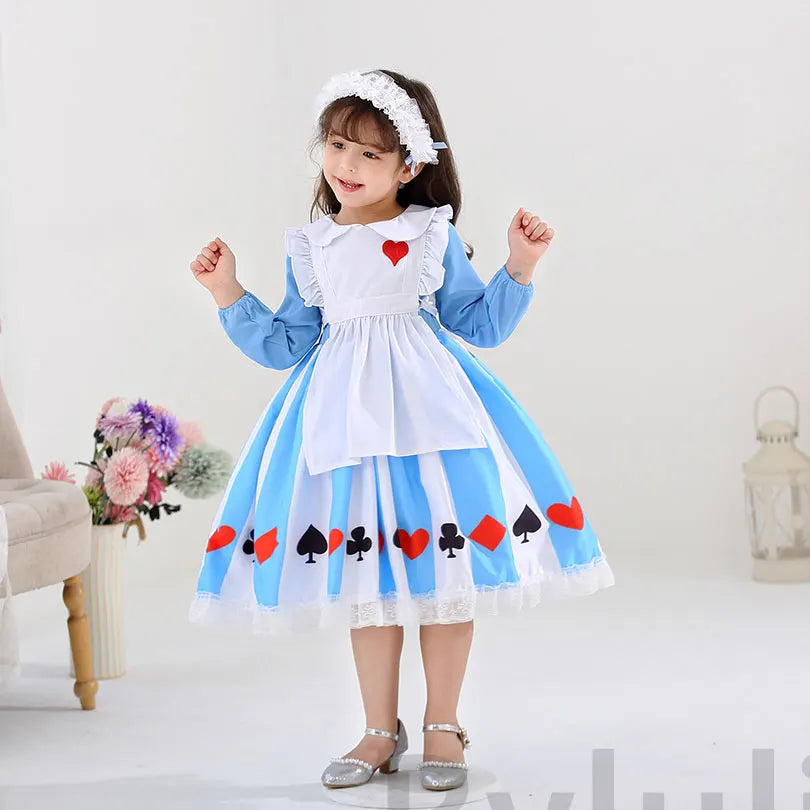 Girl wearing kids Alice in Wonderland costume blue dress with white apron heart patch and card suit skirt