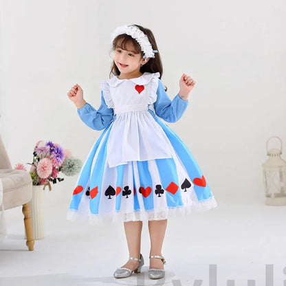 Girl wearing kids Alice in Wonderland costume blue dress with white apron heart patch and card suit skirt