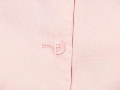 Close-up of a button on a pink blouse from EtherealBe, part of a casual chic office lady pantsuit