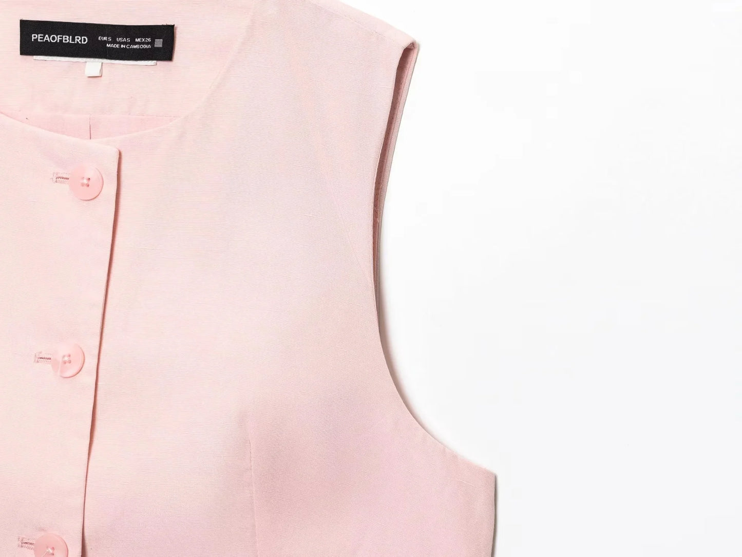 EtherealBe casual chic office lady pantsuit in blush pink with button details and sleeveless design