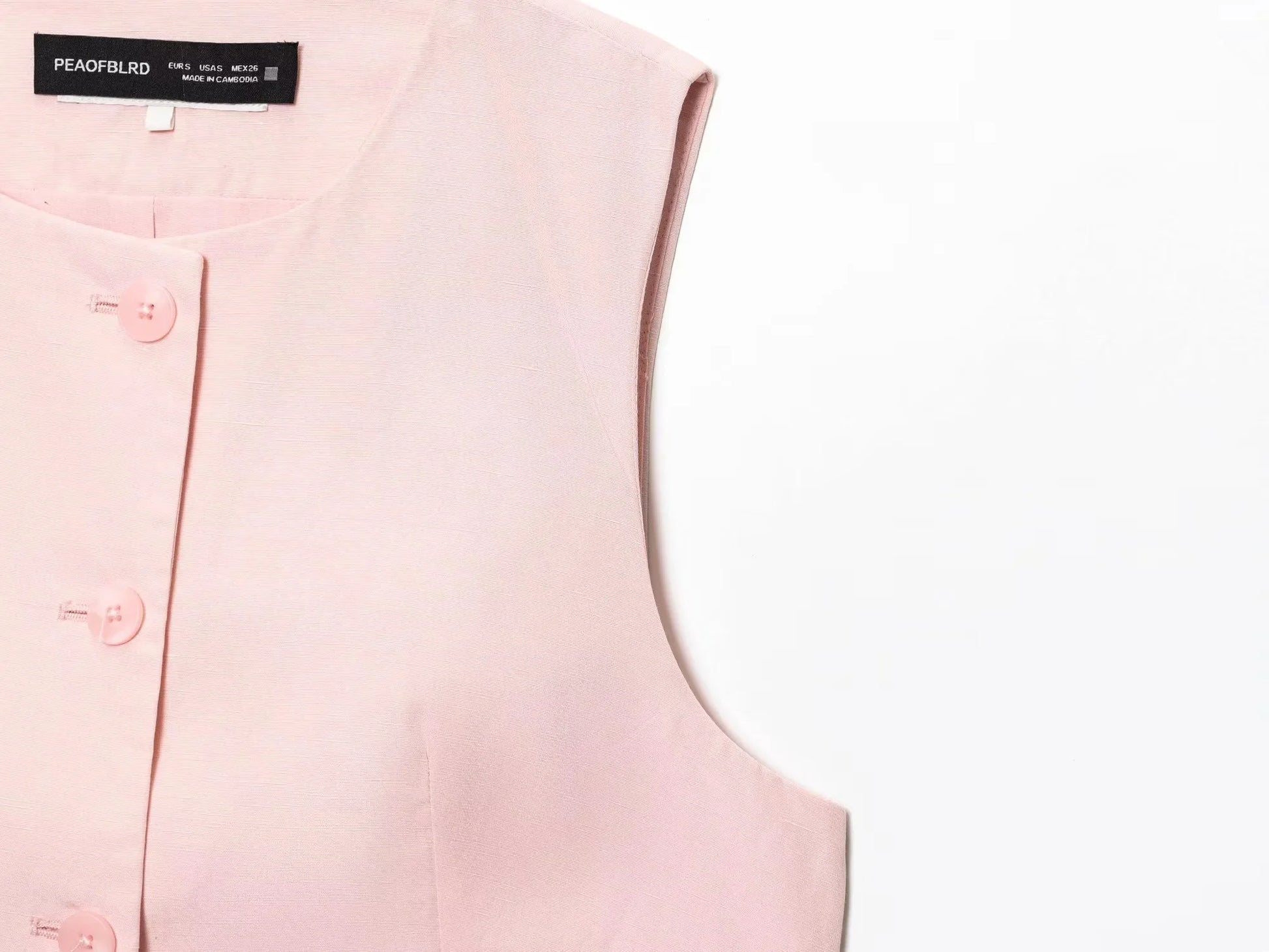 EtherealBe casual chic office lady pantsuit in blush pink with button details and sleeveless design