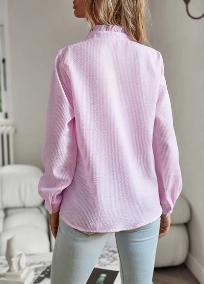 Back view of a light pink blouse, perfect as casual comfort tops for women, styled with a relaxed fit