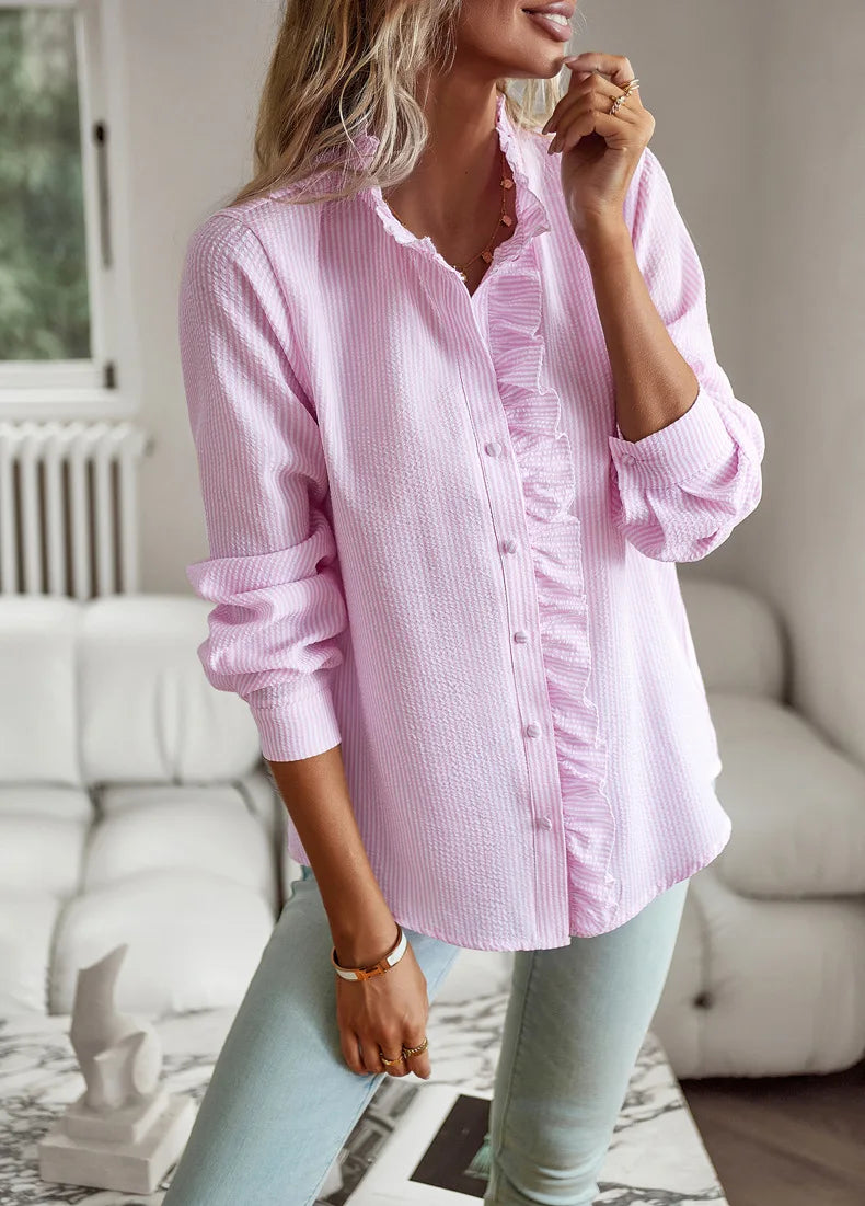 Light pink casual comfort tops for women with ruffle detail and button-up front in a cozy setting