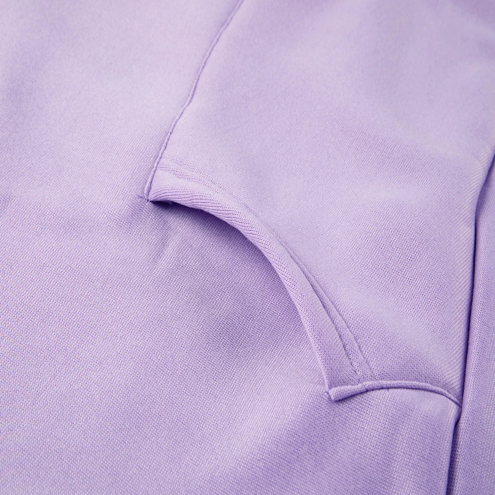 Close-up of a purple casual fleece 2 piece hoodie outfits for women showcasing soft fabric and detailed stitching