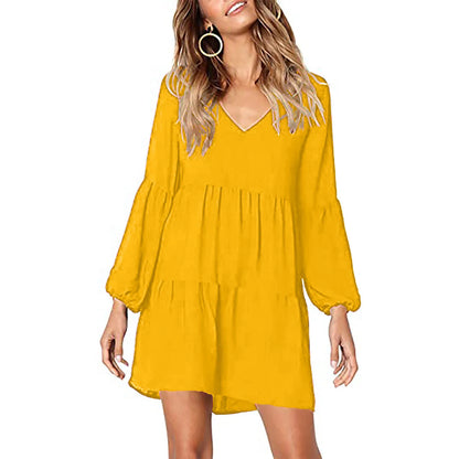 Women’s casual long sleeve v neck dress in yellow with a flowy tiered design