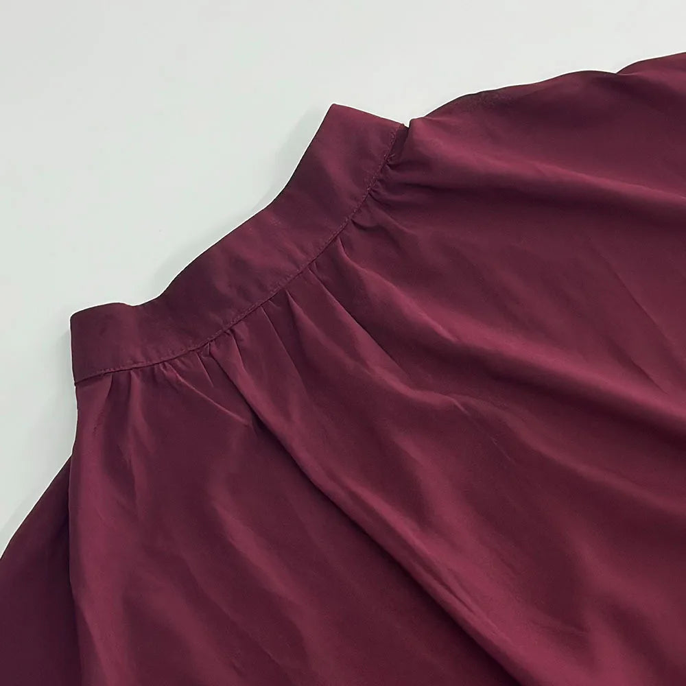 Chic long sleeve o-neck sheer top in maroon featuring a gathered neckline for a stylish look