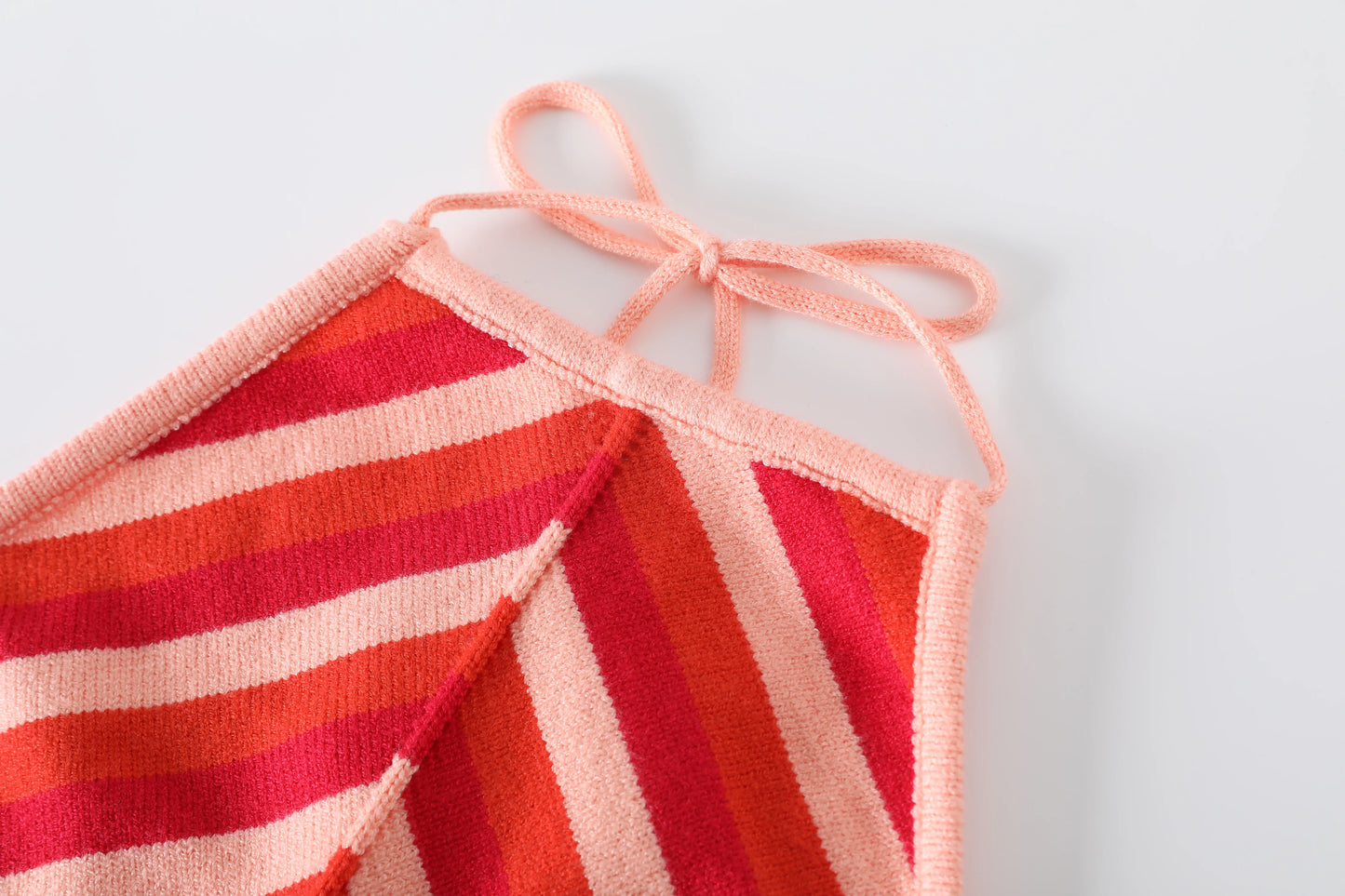 Chic sleeveless lace-up halter dress with vibrant pink and orange striped design