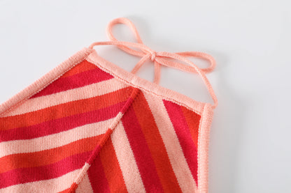 Chic sleeveless lace-up halter dress with vibrant pink and orange striped design