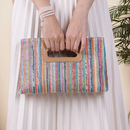 Chic straw woven shoulder bag in vibrant colors with a stylish handle for fashionable outings