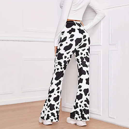 Woman wearing comfortable animal print lounge pants with a stylish cow pattern for casual relaxation