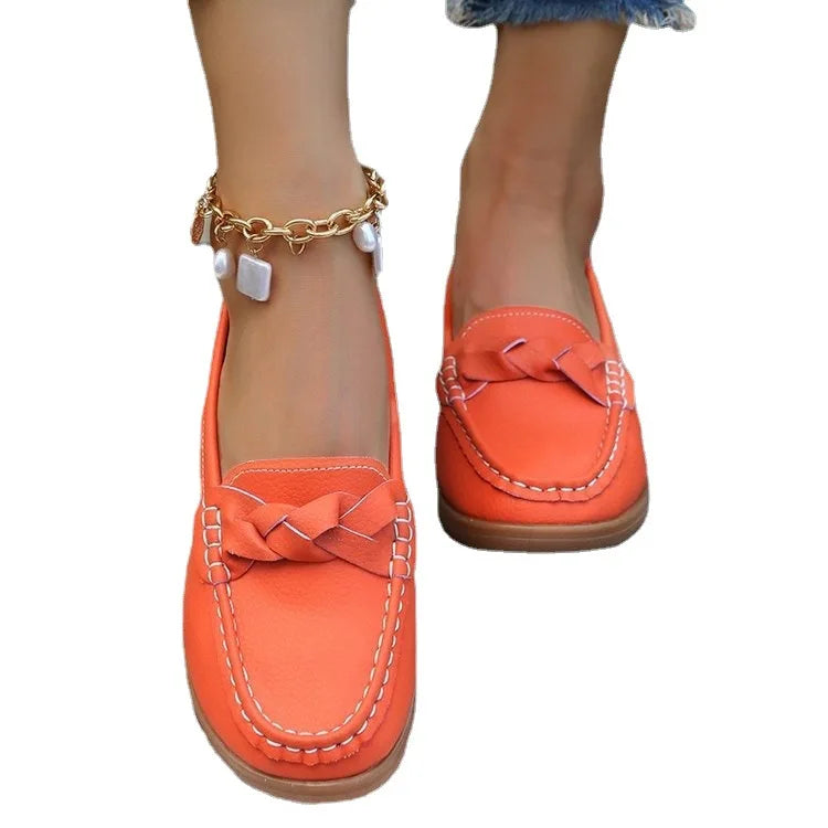 EtherealBe comfortable slip on flats for women in vibrant orange with braided detail and casual style