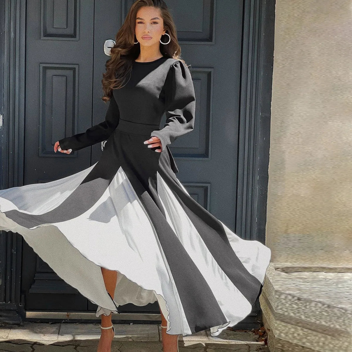 EtherealBe contrasting color mid-waist dress with flowing layers in black and white for elegant occasions