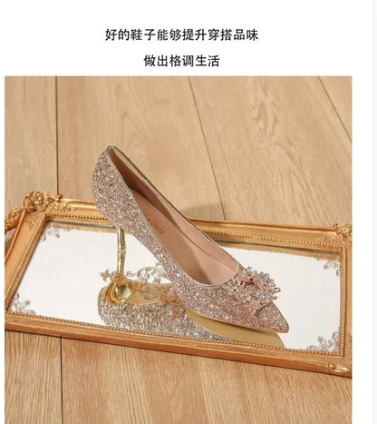 EtherealBe crystal high heel wedding shoes with a sparkling design and elegant bow on a reflective surface