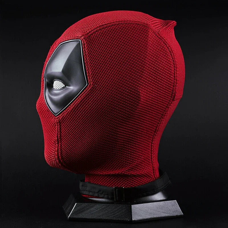 Red textured Deadpool costume mask for Halloween. Side profile on black display stand showing molded eye detail