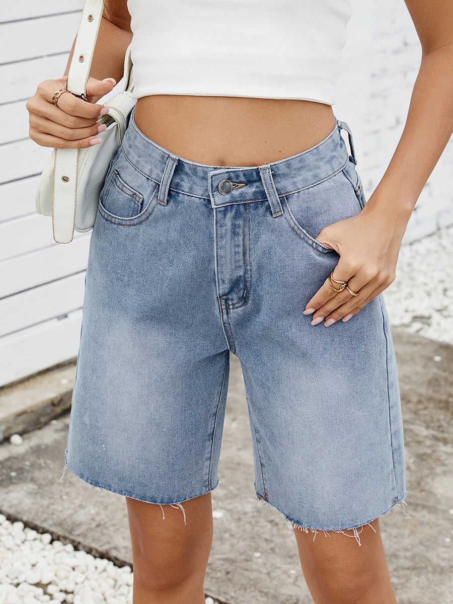 Trendy distressed denim shorts for women featuring a high waist and frayed hem for a casual summer look