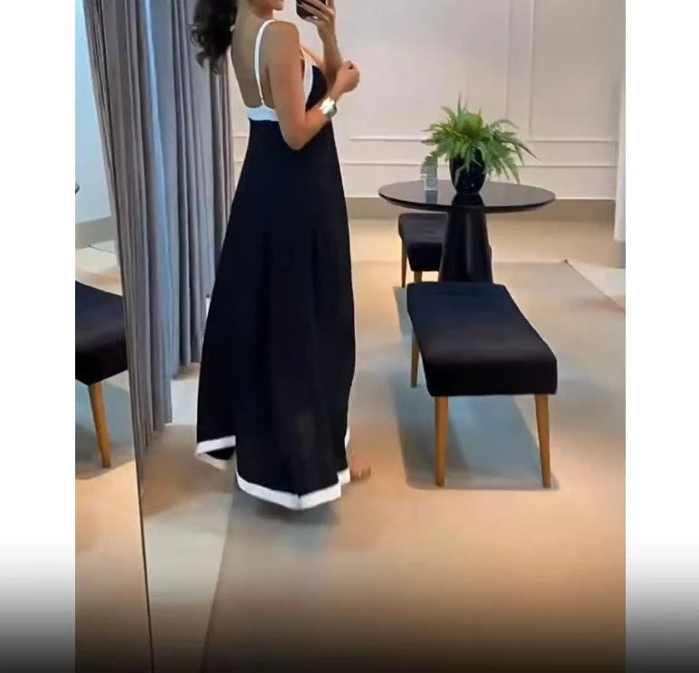 Elegant black and white sleeveless maxi dress showcasing a stylish design and flowing silhouette