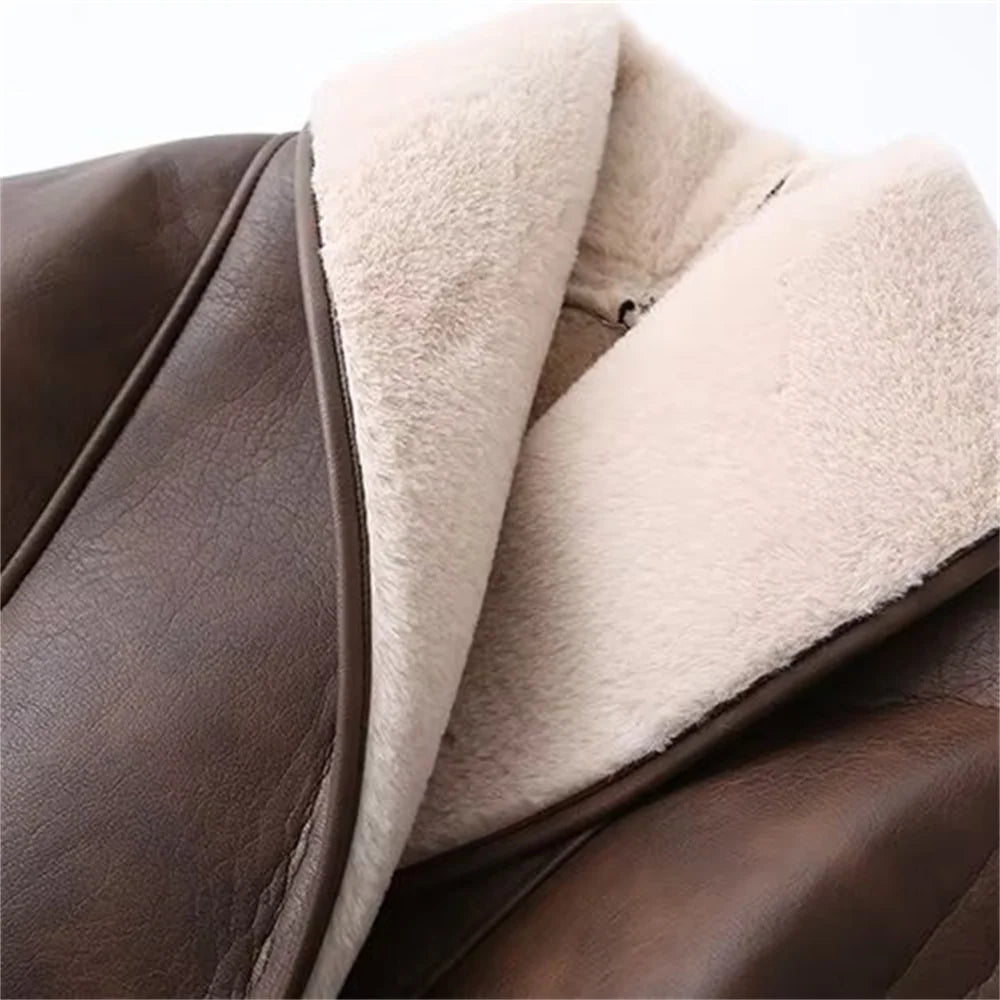 Close-up view of the soft collar of a dual color belted faux fur jacket for women