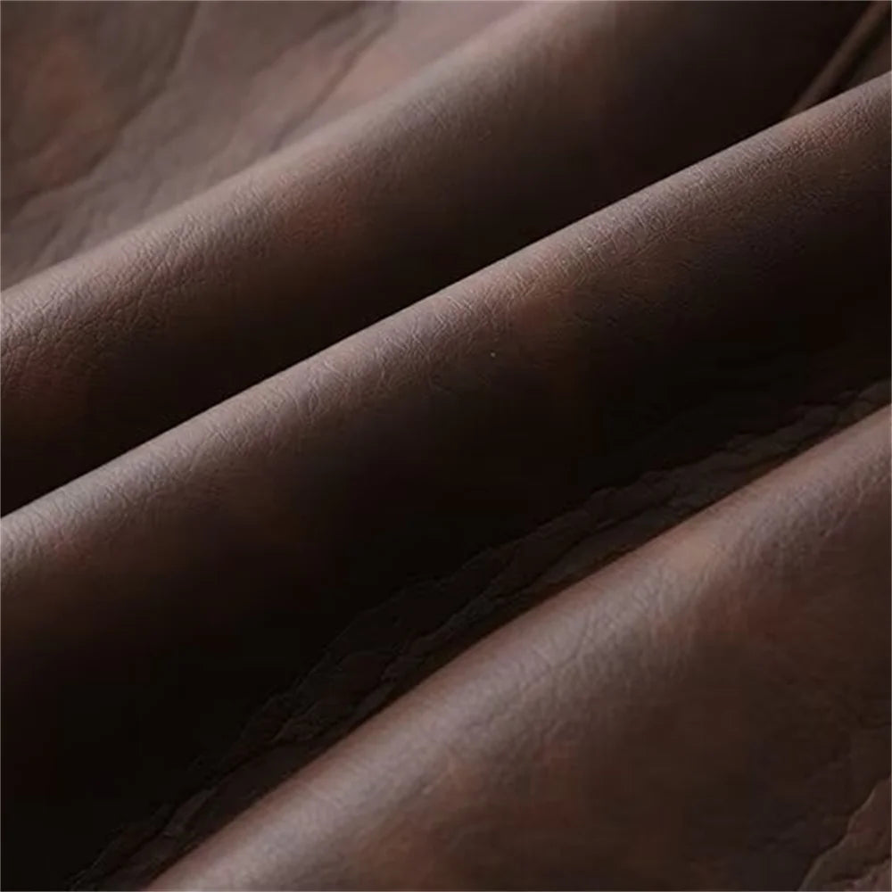Close-up of the fabric texture of a dual color belted faux fur jacket for women