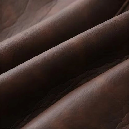 Close-up of the fabric texture of a dual color belted faux fur jacket for women