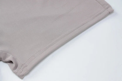 EtherealBe beige stretch fabric close up hem and stitching detail of bodycon romper for women