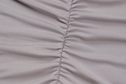 Light mauve ruched stretch fabric closeup showing center seam on bodycon romper for women